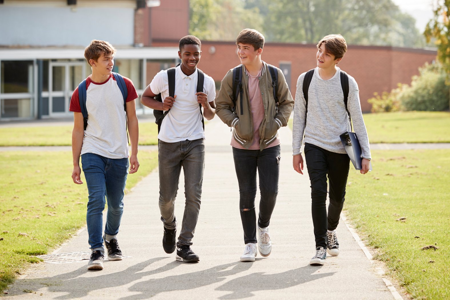 Group of Male Teenage Students Walking